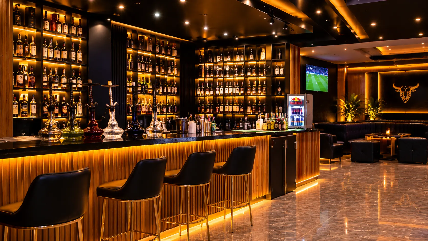 Backlit bar with shelves of bottles, leather bar stools and hookahs on the counter
